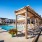 Swimming pool with sundeck and pergola