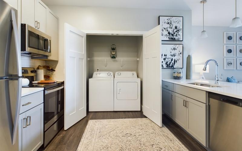 a kitchen with laundry room